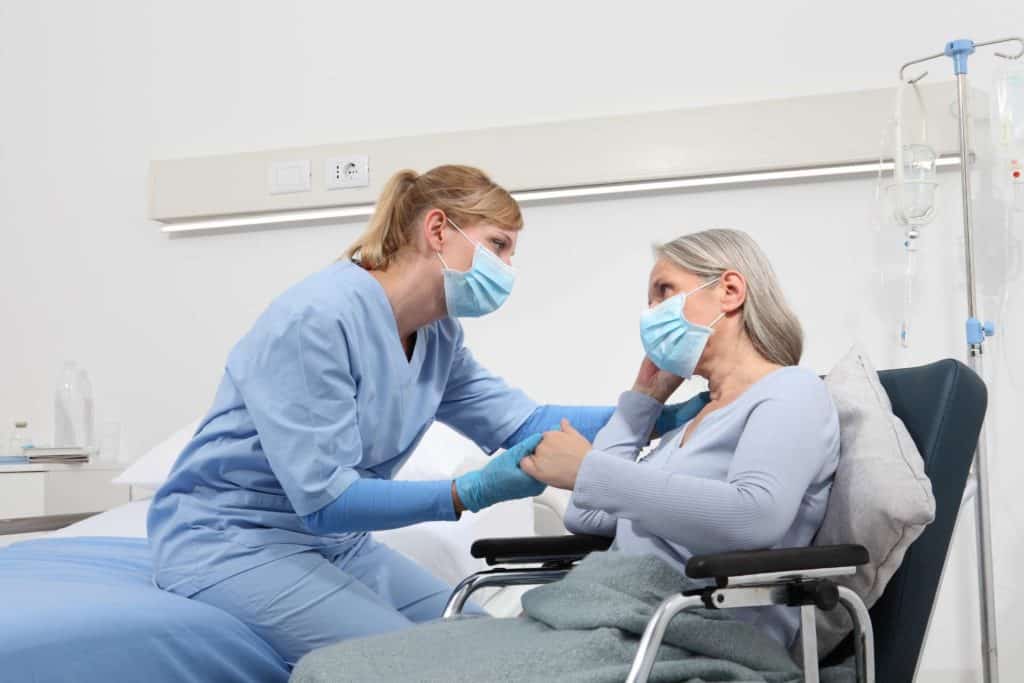 Nurse with Patient during pandemic