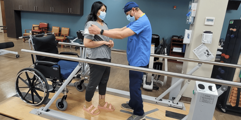 Woman receiving outpatient therapy with physical therapist