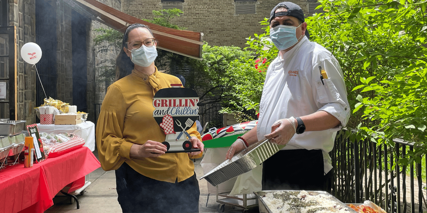 Dining staff grilling for residents during a summer party sponsored by donors of our non-profit organization.