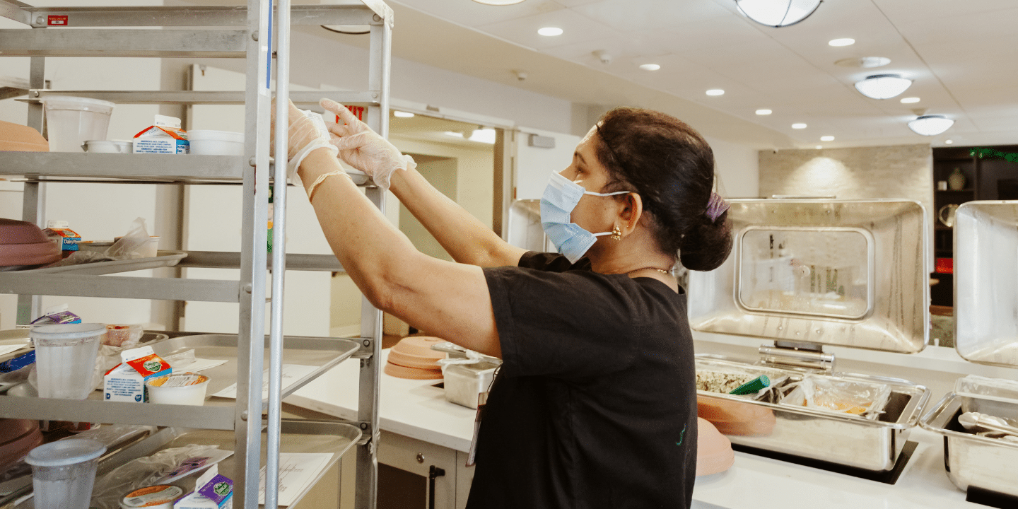 Photo of dining services team member preparing meals for Methodist Home rehab patients